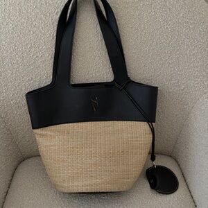 Vera Wang rattan bag.